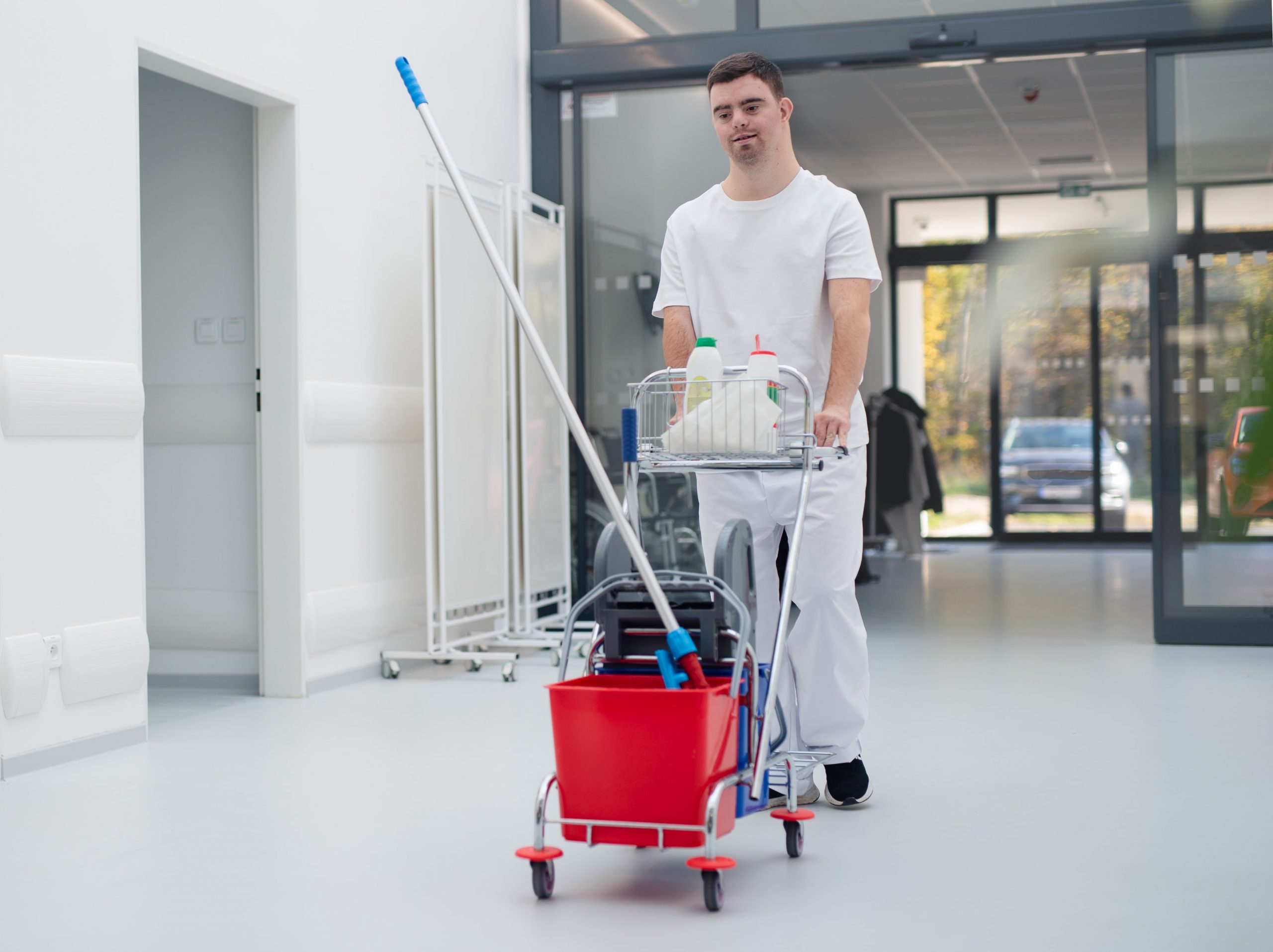 young-man-with-down-syndrome-working-in-a-hospital-2023-03-08-22-37-36-utc-min